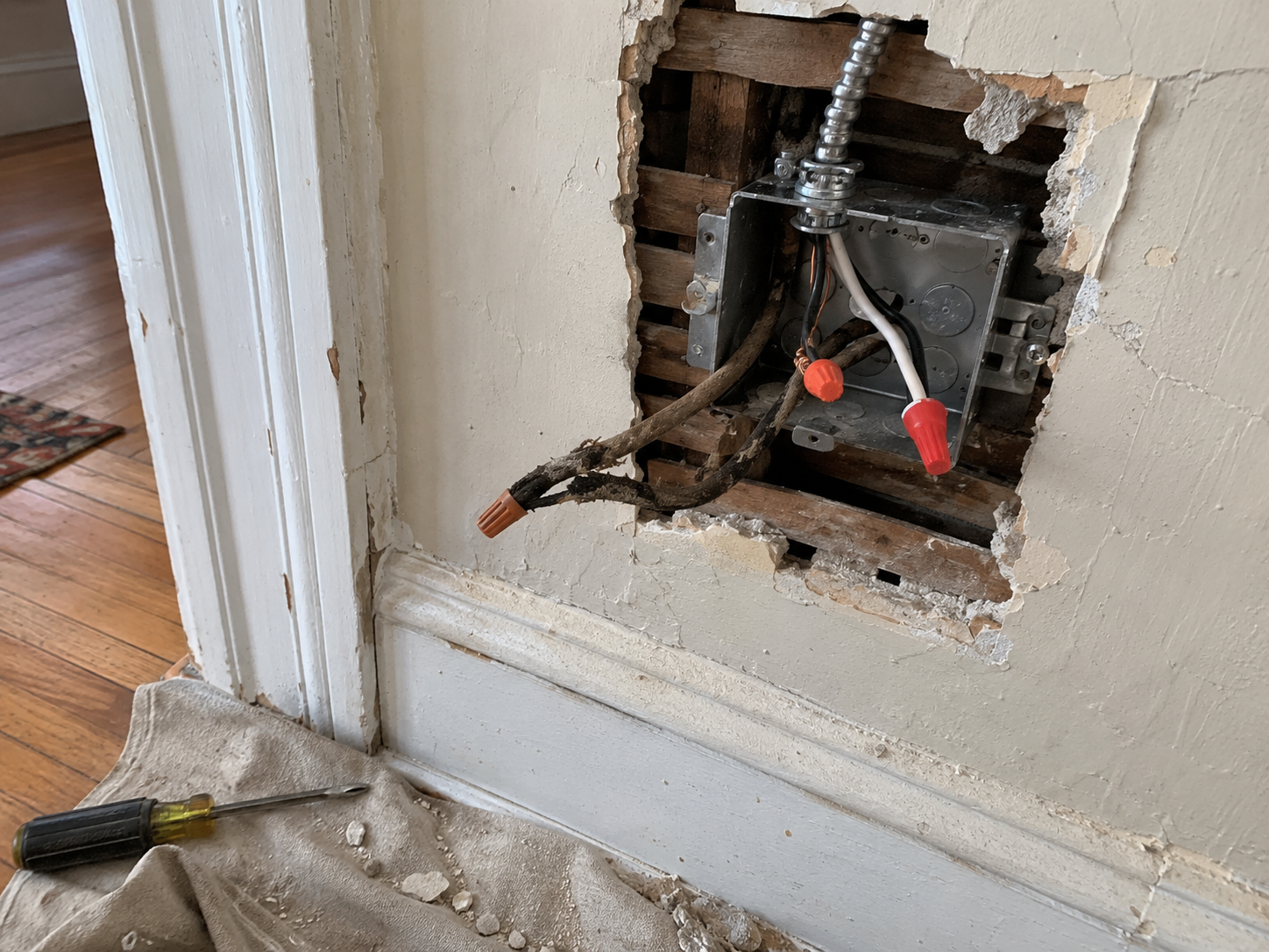 Old cloth-insulated wiring being replaced in a prewar Queens apartment